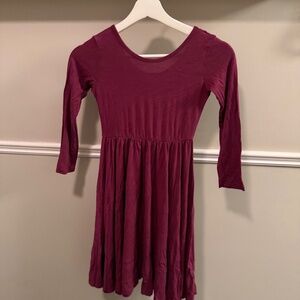 Kyte Baby long sleeve bamboo twirl dress in a rich burgundy/wine color. Size 7Y